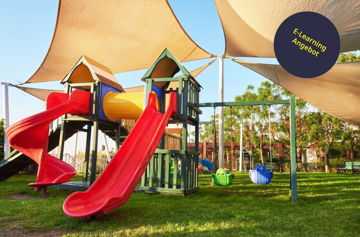 Colorful playground in the yard in the park at sunset.